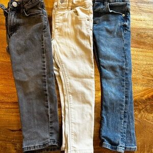Stylish Trio of Jeans in Black, Cream, and Blue